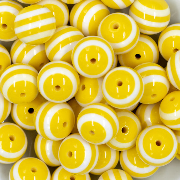 close-up view of a pile of 20mm Yellow with White Stripes Chunky Bubblegum Beads