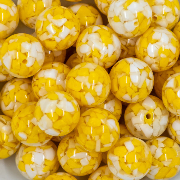 close-up view of a pile of 20mm Yellow Tablet Acrylic Chunky Bubblegum Beads