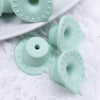 macro view of mint green silicone cowboy hats pink