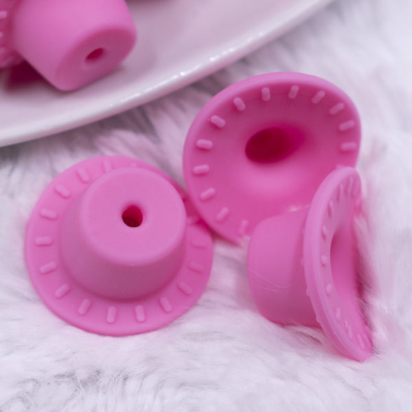macro view of pink silicone cowboy hats pink