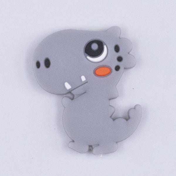 Top view of a Gray Dinosaur Silicone Focal Bead Accessory - 26mm x 33mm
