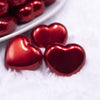 Macro view of a pile of 27mm Red Pearl Heart Acrylic Bubblegum Beads