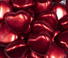 Close up view of a pile of 27mm Red Pearl Heart Acrylic Bubblegum Beads