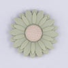 Top view of a green 30mm silicone daisy flower beads