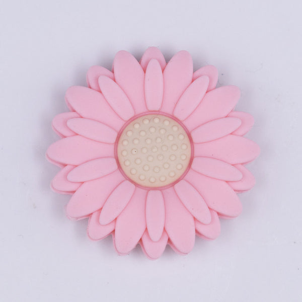 Top view of a pink 30mm silicone daisy flower beads