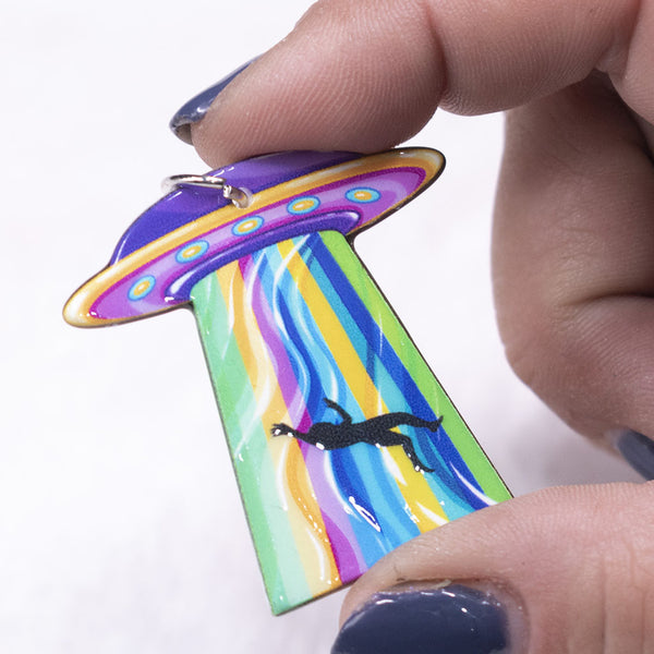 front view of a Spaceship Abduction resin charm 40x40mm