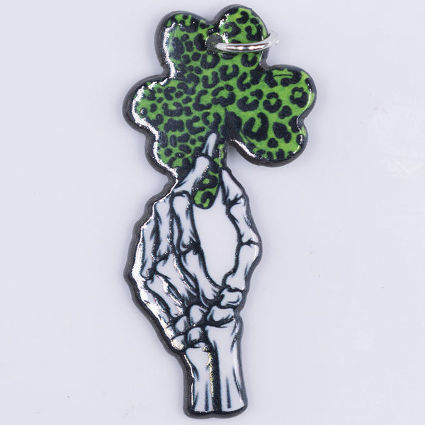 Top view of a aSkeleton hand holding a clover with hoop 48x23mm