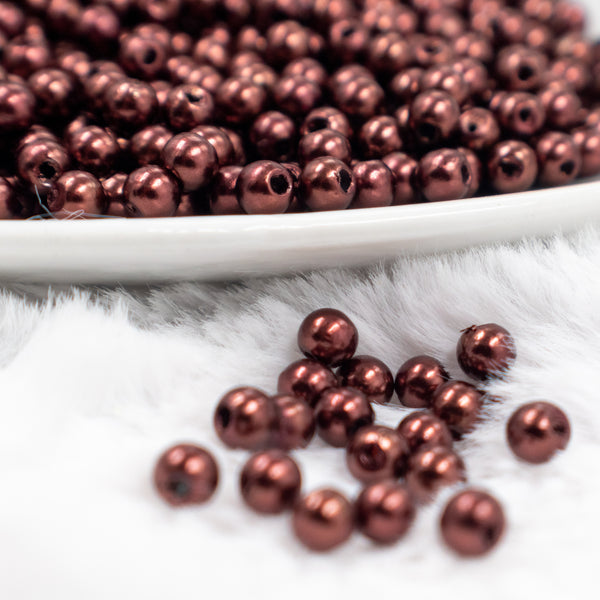 Close up front view of a pile of 4mm Brown Pearl Spacer Beads [100-120 Count]
