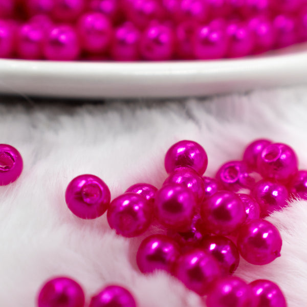 Close up front view of a pile of 4mm Purple Fuschia Pearl Spacer Beads [100-120 Count]