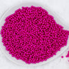 Top view of a pile of 4mm Purple Fuschia Pearl Spacer Beads [100-120 Count]