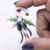 front view of a pile of Candy Cane Christmas Pendant with Skeleton and with hoop 35x50mm