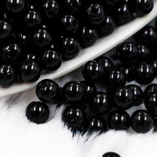 close up view of a pile of 6mm Black Pearl Spacer Beads