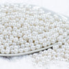 front view of a pile of 6mm White Pearl Spacer Beads
