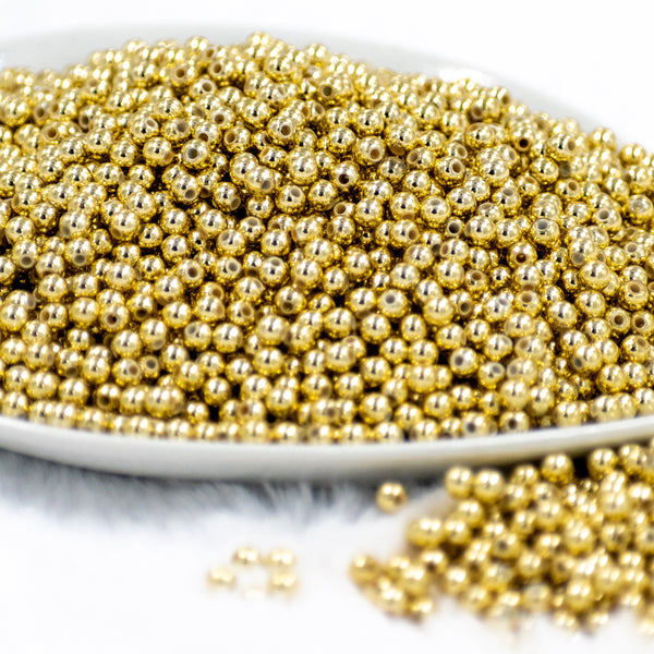 front view of a pile of 4mm Gold Acrylic Spacer Beads 100-120 Count