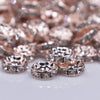 macro view of a pile of 10mm Rose Gold Rondelle Spacer Beads - Set of 20