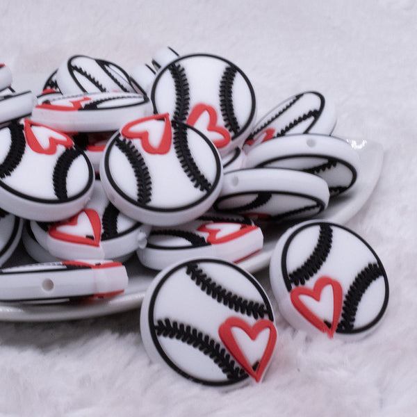 Front view of a pile of BaseballSilicone Focal Bead Accessory - 29mm x 28mm