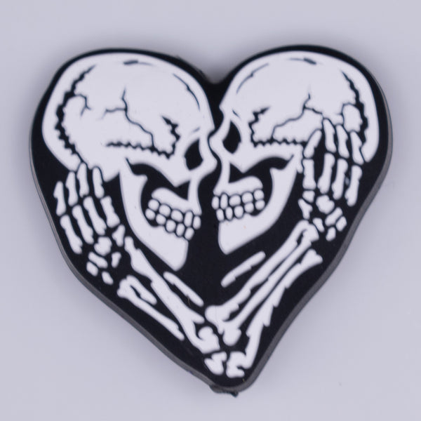 Macro view of Black and White Skull Heart Silicone Focal Bead Accessory
