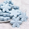 front view of a pile ofBlue Snowflake Silicone Focal Bead Accessory - 40mm x 40mm