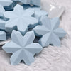 macro view of a pile ofBlue Snowflake Silicone Focal Bead Accessory - 40mm x 40mm