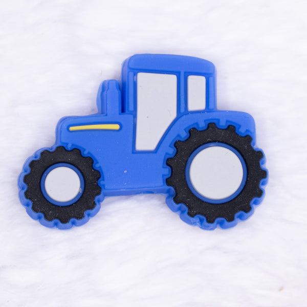 close up view of a Blue Tractor Silicone Focal Bead Accessory