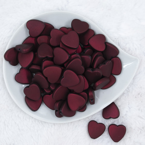 Top view of a pile of 20mm Dark Red Rubberized Style Heart Beads