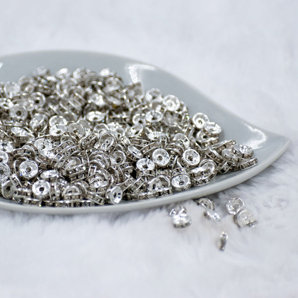 front view of a pile of 8mm Silver Rondelle Spacer Beads [Set of 20]