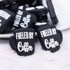 front view of a pile of Fueled By Coffee White on Black Silicone Focal Bead Accessory