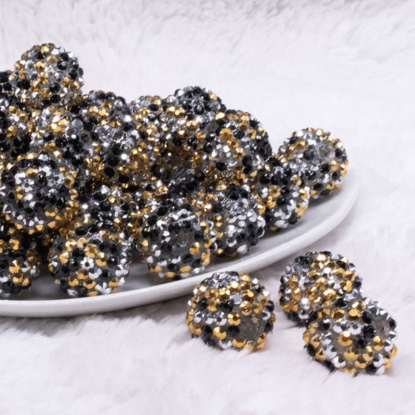 front view of a pile of 20mm Gold, Silver and Black Confetti Rhinestone AB Acrylic Bubblegum Beads