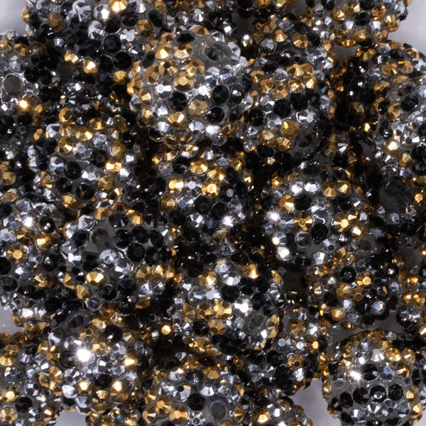 close up view of a pile of 20mm Gold, Silver and Black Confetti Rhinestone AB Acrylic Bubblegum Beads