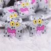 close up view of a pile of Little Gray Monster Silicone Focal Bead Accessory