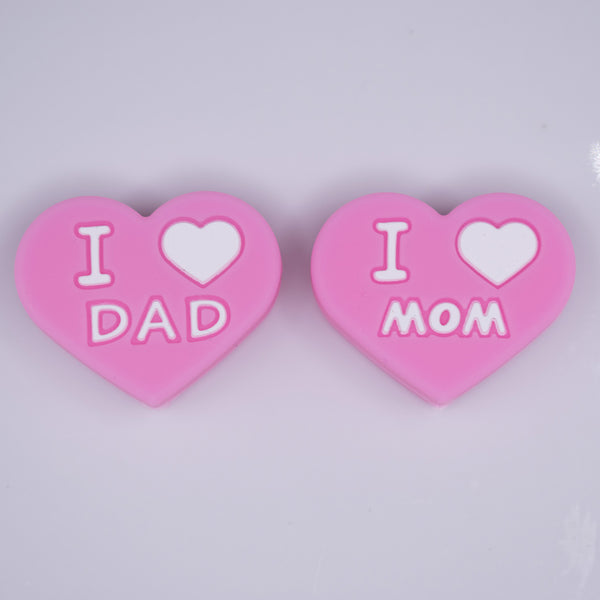 macro view of I Love Mom / Dad Pink Heart Silicone Focal Bead Accessory