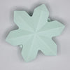 top view of a pile of Mint Green Snowflake Silicone Focal Bead Accessory - 40mm x 40mm