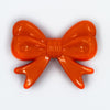 Top view of Red Acrylic Bows Pendants for chunky bubblegum bead creations - 46mm