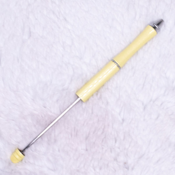 Top view of a pastel yellow DIY Beadable Pens - Metal