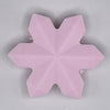 top view of a pile of Pink Snowflake Silicone Focal Bead Accessory - 40mm x 40mm