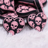 Close up view of Black heart with Pink Skull Silicone Focal Bead Accessory