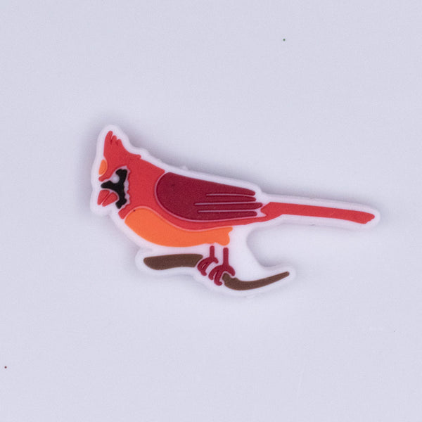Top view of a Red Cardinal Silicone Focal Bead Accessory