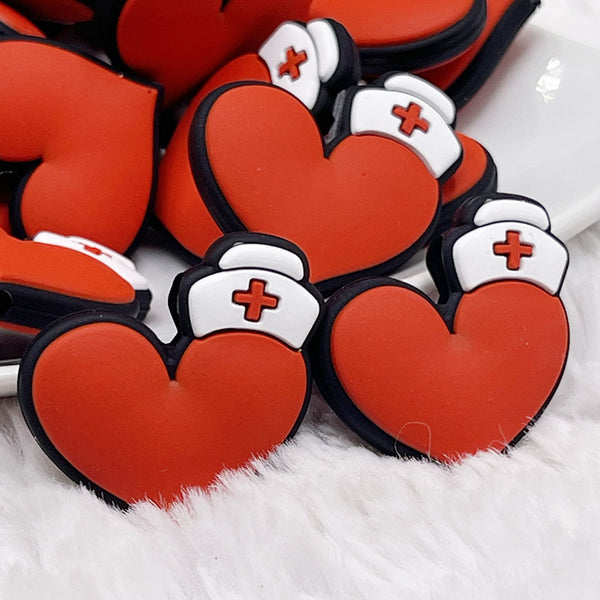 close up view of a pile of Nurse Silicone Focal Bead Accessory - 30mm x 30mm