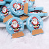 Close up view of a pile of Santa Snow Globe Silicone Focal Bead Accessory