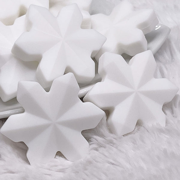 macro view of a pile of White Snowflake Silicone Focal Bead Accessory - 40mm x 40mm