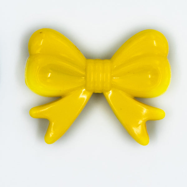 Top view of yellow Acrylic Bows Pendants for chunky bubblegum bead creations - 46mm