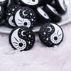 close up view of a pile of Yin and Yang Silicone Focal Bead Accessory