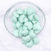 Top view of a pile of 20mm Aqua Blue heart silicone bead