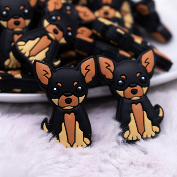 close up view of a pile of Black and Brown Dog Silicone Focal Bead Accessory