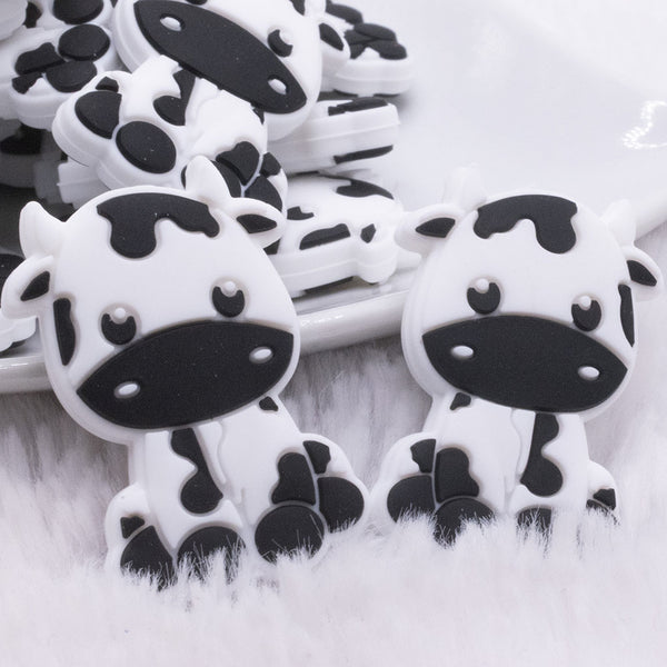 Macro view of Black and White Cow Silicone Focal Bead Accessory - 22mm x 34mm