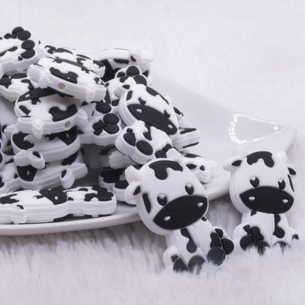 Front view of Black and White Cow Silicone Focal Bead Accessory - 22mm x 34mm