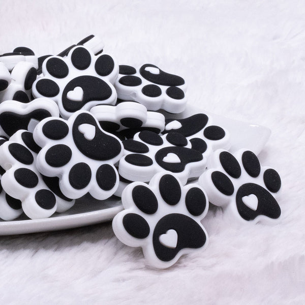 front view of Black and White Paw Print Silicone Focal Bead Accessory