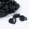 Micro view of a pile of 27mm Black Pearl Heart Acrylic Bubblegum Beads