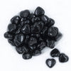 Top view of a pile of 27mm Black Pearl Heart Acrylic Bubblegum Beads