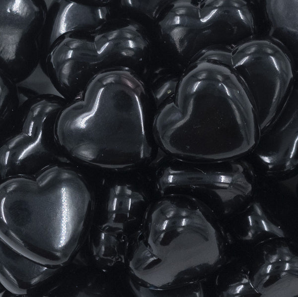 Close up view of a pile of 27mm Black Pearl Heart Acrylic Bubblegum Beads